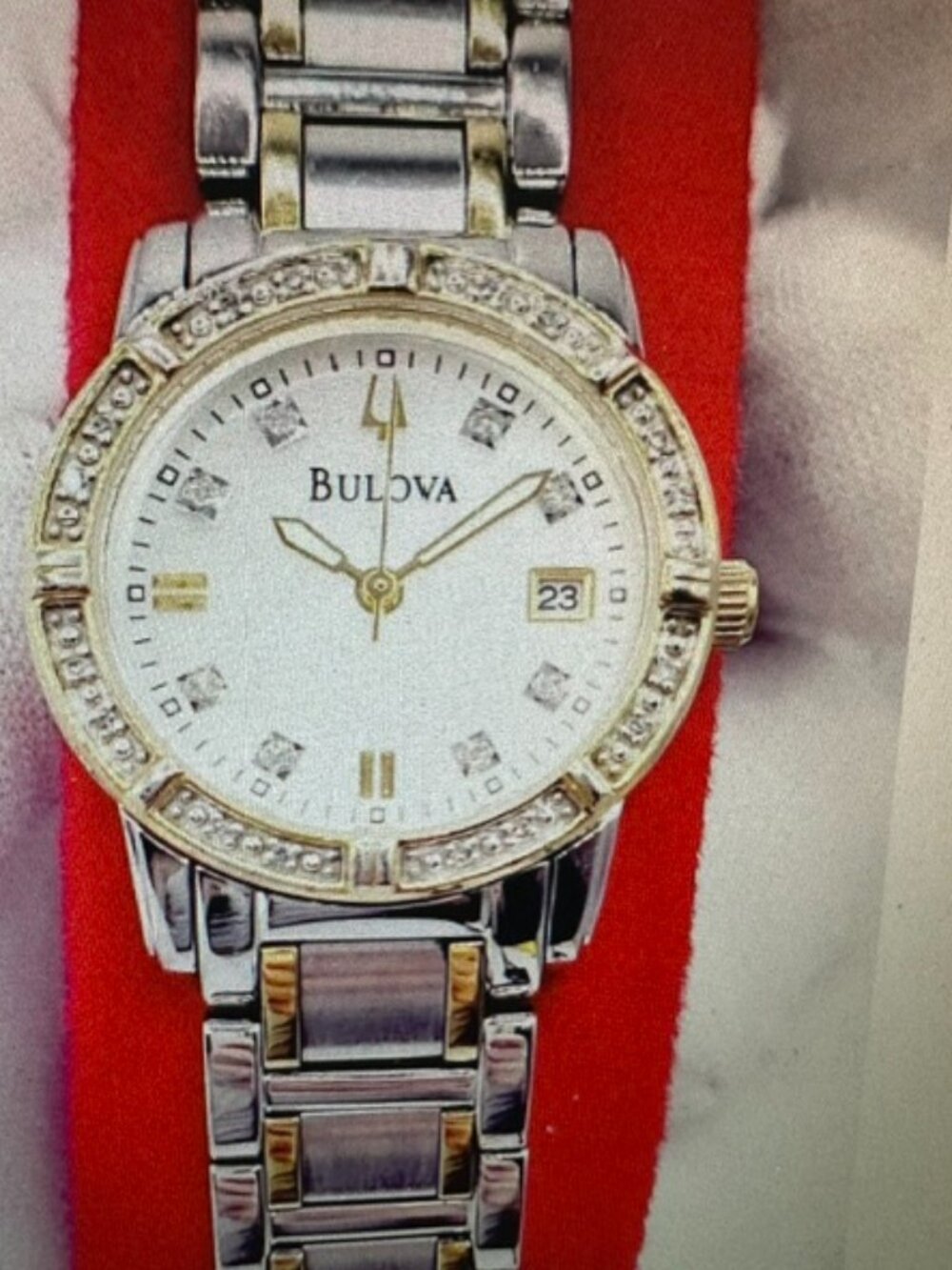 Bulova Analog Ladies Watch with 24 diamonds and Mother of Pear face.